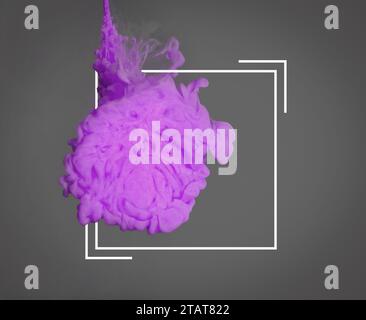Splash of violet ink and frame on grey background Stock Photo