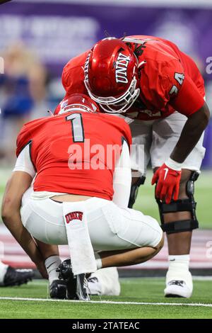 December 02, 2023: UNLV Rebels offensive lineman Jalen St. John (74) check on UNLV Rebels quarterback Jayden Maiava (1) during the second half of the Mountain West Football Championship game featuring the Boise State Broncos and the UNLV Rebels at Allegiant Stadium in Las Vegas, NV. Christopher Trim/CSM. Stock Photo