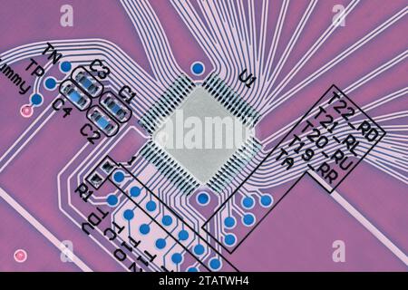 Microprocessor on a printed circuit board, close-up, top view, in inverted colors. Macro photography Stock Photo