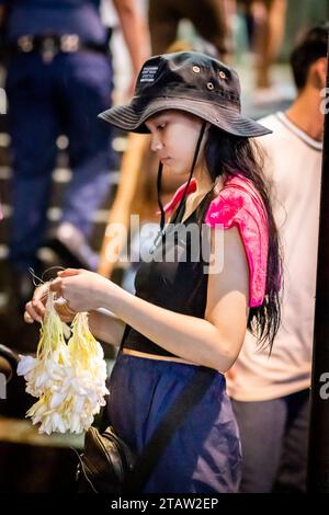 A pretty young Filipino girl sells flower garlands at Santo Nino de ...