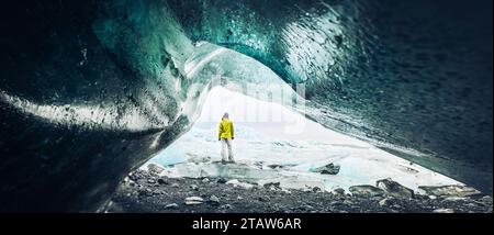 Panoramic viewpoint tourist by Fjallsjökull glacier in Iceland from inside glacier cave. Explore sightseeing Iceland spectacular hidden gems. Traveler Stock Photo