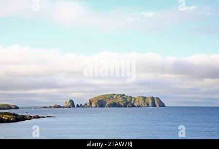 A view of Flodaigh island from Bosta Beach on Great Bernera on the west coast of the Isle of Lewis, Outer Hebrides, Scotland. Stock Photo