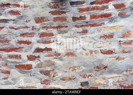 rough old brick wall background, real texture on fortress facade Stock Photo