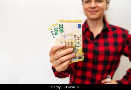 200 euro bills in female hand. Stock Photo