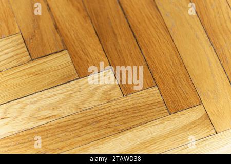 Wooden parquet floor background. Old vintage parquet on the floor in the living room. Interior design concept. High quality photo Stock Photo
