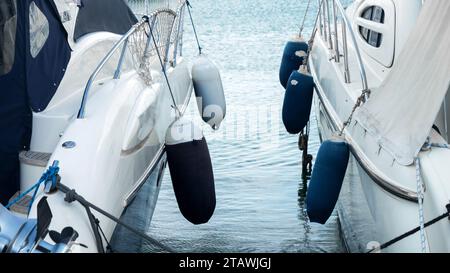 Fender and buoys on the boards of modern yachts or ships. Stock Photo