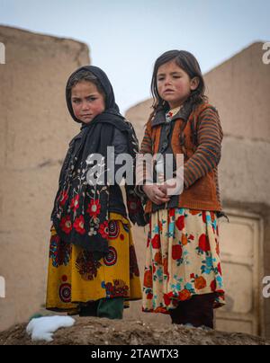 Needy refugee children in a dire situation seeking assistance | Refugee children in need, looking for help in a difficult situation. Stock Photo