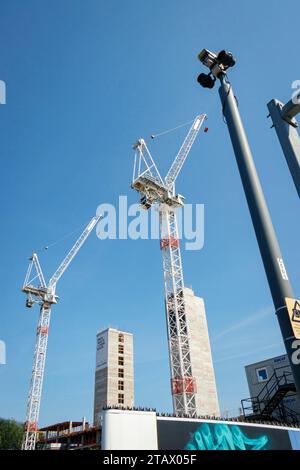 two construction cranes new urban quarter the goods yard developers capital & centric stoke on trent staffordshire with lift shaft concrete core Stock Photo