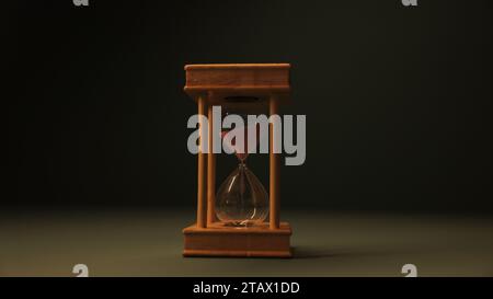 Hourglass against dark background | sandglass, sand timer, or sand clock Stock Photo