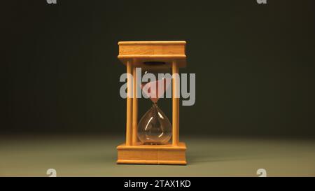 Hourglass against dark background | sandglass, sand timer, or sand clock Stock Photo