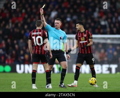 Referee Thomas Bramall shows a yellow card to Bournemouth's Ryan Christie during the Premier League match at the Vitality Stadium, Bournemouth. Picture date: Sunday December 3, 2023. Stock Photo