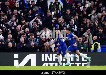 Chelsea's Enzo Fernandez (right) celebrates scoring their side's third goal of the game during the Premier League match at Stamford Bridge, London. Picture date: Sunday December 3, 2023. Stock Photo