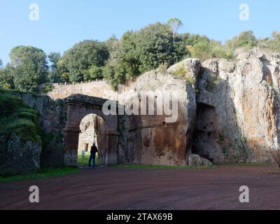 Man stands at the entrance to the Roman amphitheater in the town of Sutri, Lazio Region, Italy, December 3rd 2023 Stock Photo