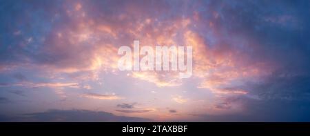 Beautiful sky with clouds during sunset or sunrise. Panoramic skyscape. Stock Photo