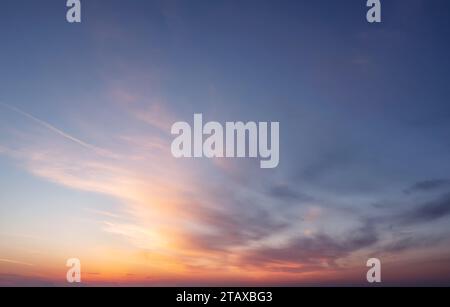 Beautiful sky with clouds during sunset or sunrise. Panoramic skyscape. Stock Photo