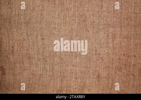 This stock photo features a close-up of a brown burlap cloth, creating a textured background for design projects Stock Photo