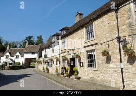 Castle Inn, Manor House and Archway Cottage, West Street, Castle Combe, Wiltshire, UK, April 2023. Stock Photo