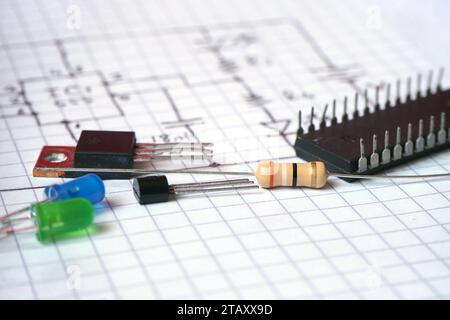 Electronic components on hand drawn circuit diagram. Electronic projects background. Electric-Electronic engineering. Selected focus. Stock Photo