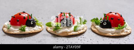 Lady bug cracker with cream cheese and tomato for summer party Stock Photo