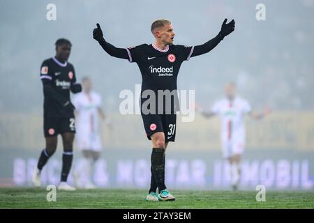 Augsburg, Germany. 03rd Dec, 2023. Soccer: Bundesliga, FC Augsburg - Eintracht Frankfurt, Matchday 13, WWK-Arena. Frankfurt's Philipp Max (r) reacts during the match. Credit: Tom Weller/dpa - IMPORTANT NOTE: In accordance with the regulations of the DFL German Football League and the DFB German Football Association, it is prohibited to utilize or have utilized photographs taken in the stadium and/or of the match in the form of sequential images and/or video-like photo series./dpa/Alamy Live News Stock Photo