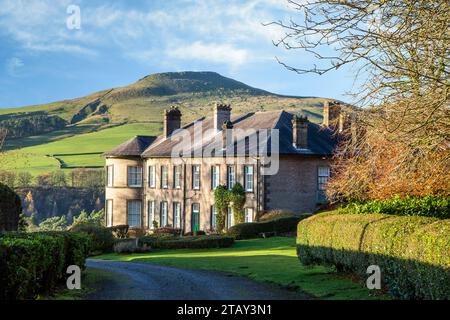 Crag Hall a country house east of the village of Wildboarclough, Cheshire, England and owned by the Earl of Derby with a view of Shutlingsloe hill Stock Photo
