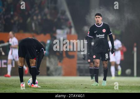 Augsburg, Germany. 03rd Dec, 2023. Soccer: Bundesliga, FC Augsburg - Eintracht Frankfurt, Matchday 13, WWK-Arena. Frankfurt's Fares Chaibi reacts during the match. Credit: Tom Weller/dpa - IMPORTANT NOTE: In accordance with the regulations of the DFL German Football League and the DFB German Football Association, it is prohibited to utilize or have utilized photographs taken in the stadium and/or of the match in the form of sequential images and/or video-like photo series./dpa/Alamy Live News Stock Photo