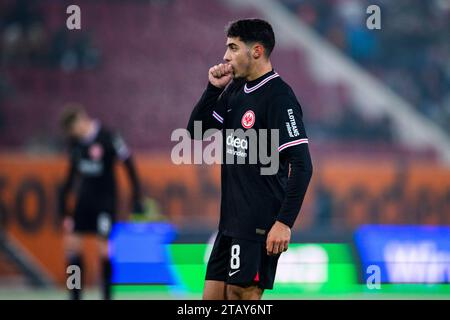 Augsburg, Germany. 03rd Dec, 2023. Soccer: Bundesliga, FC Augsburg - Eintracht Frankfurt, Matchday 13, WWK-Arena. Frankfurt's Fares Chaibi reacts during the match. Credit: Tom Weller/dpa - IMPORTANT NOTE: In accordance with the regulations of the DFL German Football League and the DFB German Football Association, it is prohibited to utilize or have utilized photographs taken in the stadium and/or of the match in the form of sequential images and/or video-like photo series./dpa/Alamy Live News Stock Photo