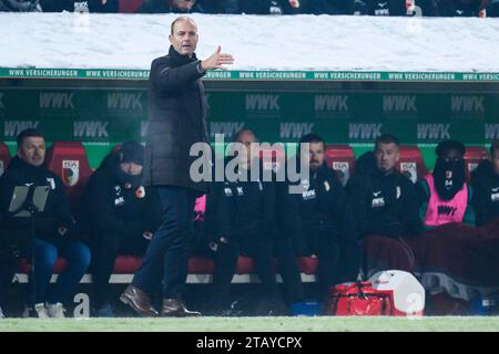 Augsburg, Germany. 03rd Dec, 2023. Soccer: Bundesliga, FC Augsburg - Eintracht Frankfurt, Matchday 13, WWK-Arena. Augsburg coach Jess Thorup gesticulates. Credit: Tom Weller/dpa - IMPORTANT NOTE: In accordance with the regulations of the DFL German Football League and the DFB German Football Association, it is prohibited to utilize or have utilized photographs taken in the stadium and/or of the match in the form of sequential images and/or video-like photo series./dpa/Alamy Live News Stock Photo