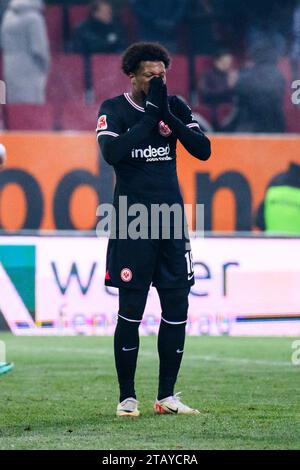 Augsburg, Germany. 03rd Dec, 2023. Soccer: Bundesliga, FC Augsburg - Eintracht Frankfurt, Matchday 13, WWK-Arena. Frankfurt's Jessic Ngankam reacts dissatisfied. Credit: Tom Weller/dpa - IMPORTANT NOTE: In accordance with the regulations of the DFL German Football League and the DFB German Football Association, it is prohibited to utilize or have utilized photographs taken in the stadium and/or of the match in the form of sequential images and/or video-like photo series./dpa/Alamy Live News Stock Photo