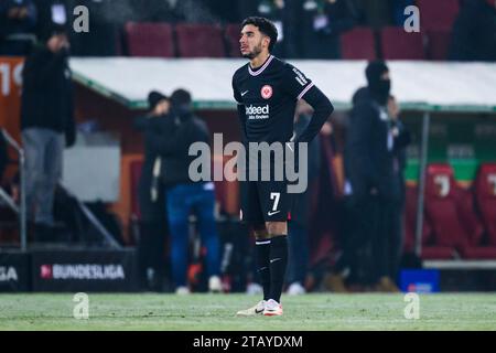 Augsburg, Germany. 03rd Dec, 2023. Soccer: Bundesliga, FC Augsburg - Eintracht Frankfurt, Matchday 13, WWK-Arena. Frankfurt's Omar Marmoush reacts dissatisfied. Credit: Tom Weller/dpa - IMPORTANT NOTE: In accordance with the regulations of the DFL German Football League and the DFB German Football Association, it is prohibited to utilize or have utilized photographs taken in the stadium and/or of the match in the form of sequential images and/or video-like photo series./dpa/Alamy Live News Stock Photo