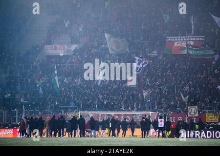 Augsburg, Germany. 03rd Dec, 2023. Soccer: Bundesliga, FC Augsburg - Eintracht Frankfurt, Matchday 13, WWK-Arena. The FC Augsburg players cheer with the fans after the match. Credit: Tom Weller/dpa - IMPORTANT NOTE: In accordance with the regulations of the DFL German Football League and the DFB German Football Association, it is prohibited to utilize or have utilized photographs taken in the stadium and/or of the match in the form of sequential images and/or video-like photo series./dpa/Alamy Live News Stock Photo