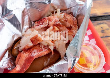 Freshly served delectable and iconic New England style lobster roll with butter Stock Photo