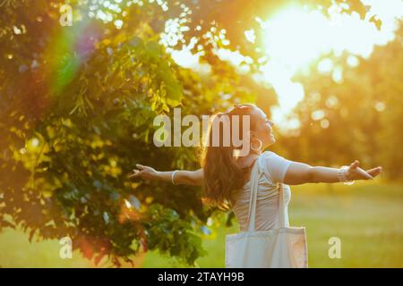 Summer time. happy stylish 40 years old woman in white shirt outdoors. Stock Photo