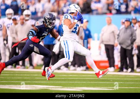 December 3, 2023: Tennessee Titans linebacker Azeez Al-Shaair (2) tackles Indianapolis Colts tight end Kylen Granson (83) during the second half of an NFL game between the Indianapolis Colts and Tennessee Titans at Nissan Stadium in Nashville TN Steve Roberts/CSM Stock Photo