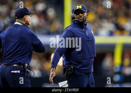 Indianapolis, Indiana, USA. 02nd Dec, 2023. Michigan head coach Jim Harbaugh and Michigan offensive coordinator Sherrone Moore during NCAA football game action between the Michigan Wolverines and the Iowa Hawkeyes at Lucas Oil Stadium in Indianapolis, Indiana. John Mersits/CSM/Alamy Live News Stock Photo