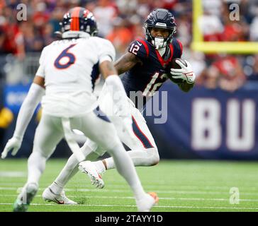 December 3, 2023: Texans wide receiver Nico Collins (12) carries the ball after a catch during an NFL game between the Texans and the Broncos on December 3, 2023 in Houston. The Texans won, 22-17. (Credit Image: © Scott Coleman/ZUMA Press Wire) EDITORIAL USAGE ONLY! Not for Commercial USAGE! Stock Photo