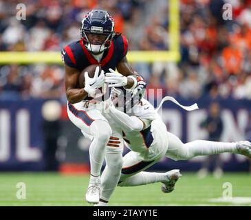 December 3, 2023: Texans wide receiver John Metchie III (8) is tackled after a catch during an NFL game between the Texans and the Broncos on December 3, 2023 in Houston. The Texans won, 22-17. (Credit Image: © Scott Coleman/ZUMA Press Wire) EDITORIAL USAGE ONLY! Not for Commercial USAGE! Stock Photo