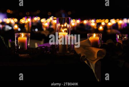 Candles on the table glowing in the night Stock Photo