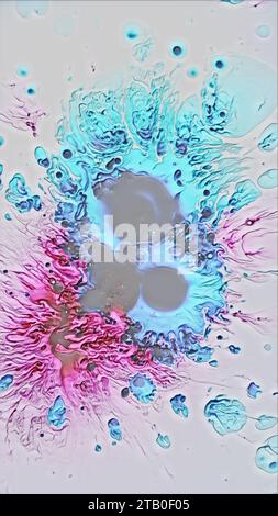 Ink drop acrylic splatter paint splash cyan pink Stock Photo