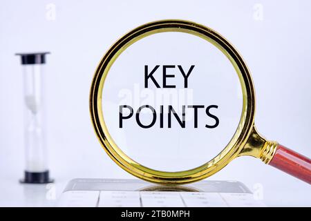 KEY POINTS text, word, inscription found through a magnifying glass next to an hourglass on a light background Stock Photo