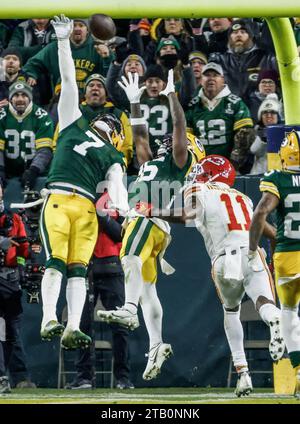 Green Bay, United States. 03rd Dec, 2023. Green Bay Packers linebacker Quay Walker (L) and Green Bay Packers safety Darnell Savage (C) break up a pass intended for Kansas City Chiefs wide receiver Marquez Valdes-Scantling (R) during the the NFL game between the Kansas City Chiefs and the Green Bay Packers at Lambeau Field in Green Bay, Wisconsin on Sunday, December 03, 2023. The Packers defeated the Chiefs 27-19. Photo by Tannen Maury/UPI Credit: UPI/Alamy Live News Stock Photo