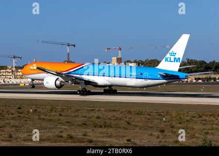 KLM - Royal Dutch Airlines Boeing 777-306-ER (Reg: PH-BVA) departing in the new updated Orange Pride scheme. Stock Photo