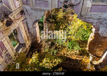 A crumbling wall of an abandoned manor house with ancient frescoes. Belkino Estate, Obninsk, Russia Stock Photo