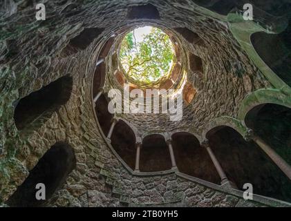 A Daytime Adventure in Quinta da Regaleira, Sintra, Portugal: A Low-Angle, Vertical Shot Stock Photo