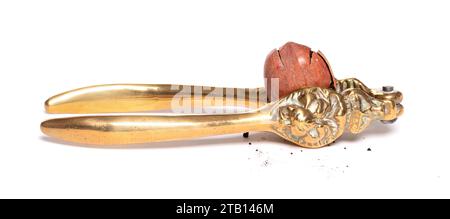 Large nut with vintage nutcracker, isolated on white Stock Photo