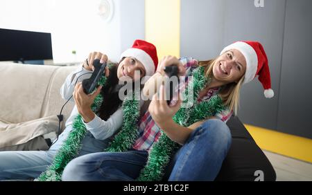 Woman hold joystick in hand and lean to side. Stock Photo