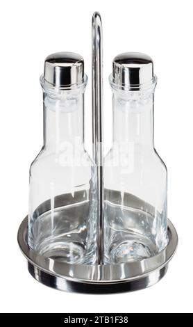 Set with two empty small bottles for oil and vinegar in a metallic holder isolated in white back Stock Photo