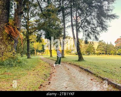 Woman walking and relaxing at beautyful green landscape of Handa Stock Photo