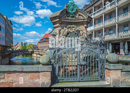 NUREMBERG, BAVARIA, GERMANY - APRIL 30, 2023: View of the Museum Bridge (Museumsbrücke formerly Barfüßerbrücke), a sandstone arch bridge that spans th Stock Photo