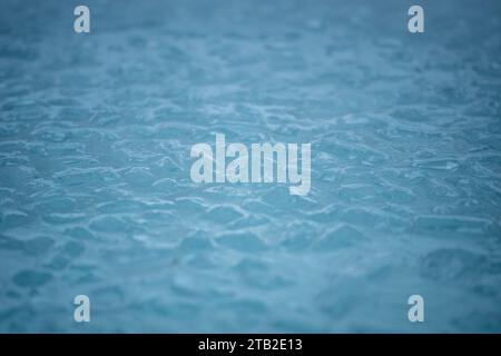 Cold water and ice cubes melting background. Global warming or climate change concept. Wim Hof Method, cold therapy, breathing techniques, yoga Stock Photo